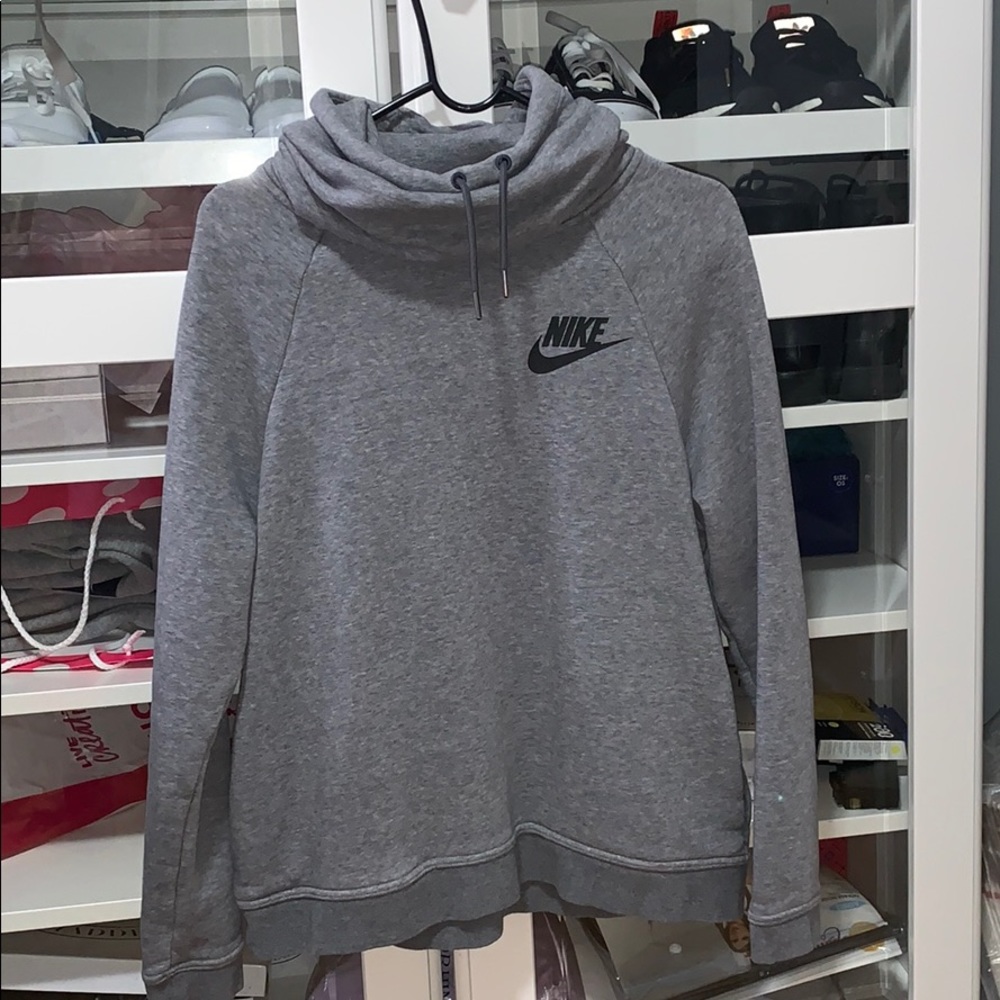 A grey Nike funnel neck pull over